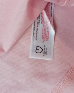 نمای داخل بلوز دخترانه نخی صورتی طرح ستاره و متن PRIMARK