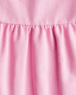 نمای نزدیک پیراهن دخترانه دورس صورتی طرح ساده h&m