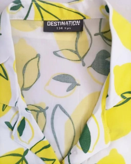 نمای لیبل شومیز دخترانه سفید نخی طرح لیمو Destination | اسکای‌تاپ مرجع تخصصی خرید لباس بچگانه